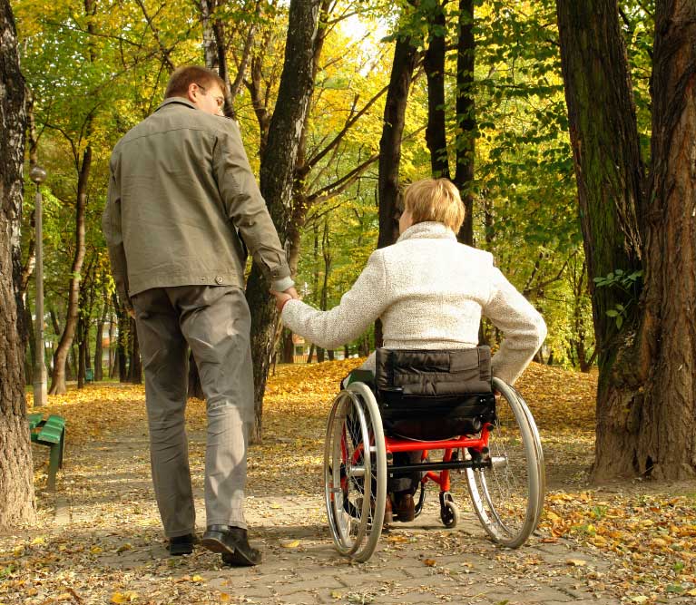 Man and woman in wheelchair